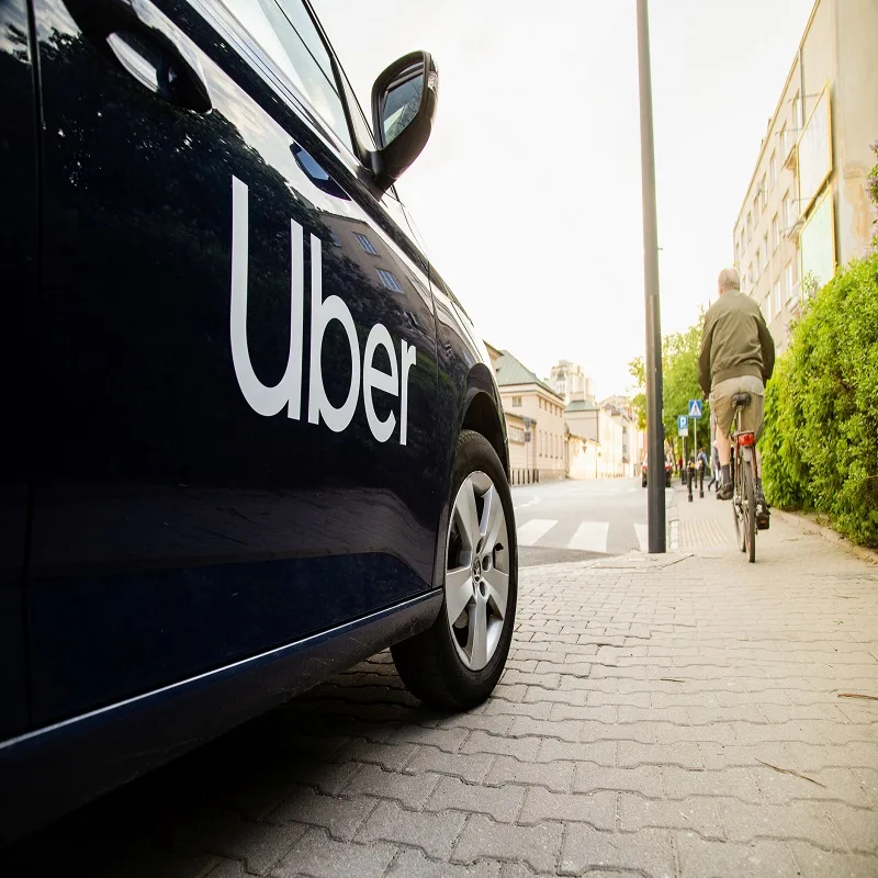 Uber Vehicle on a Street Waiting for a Passenger