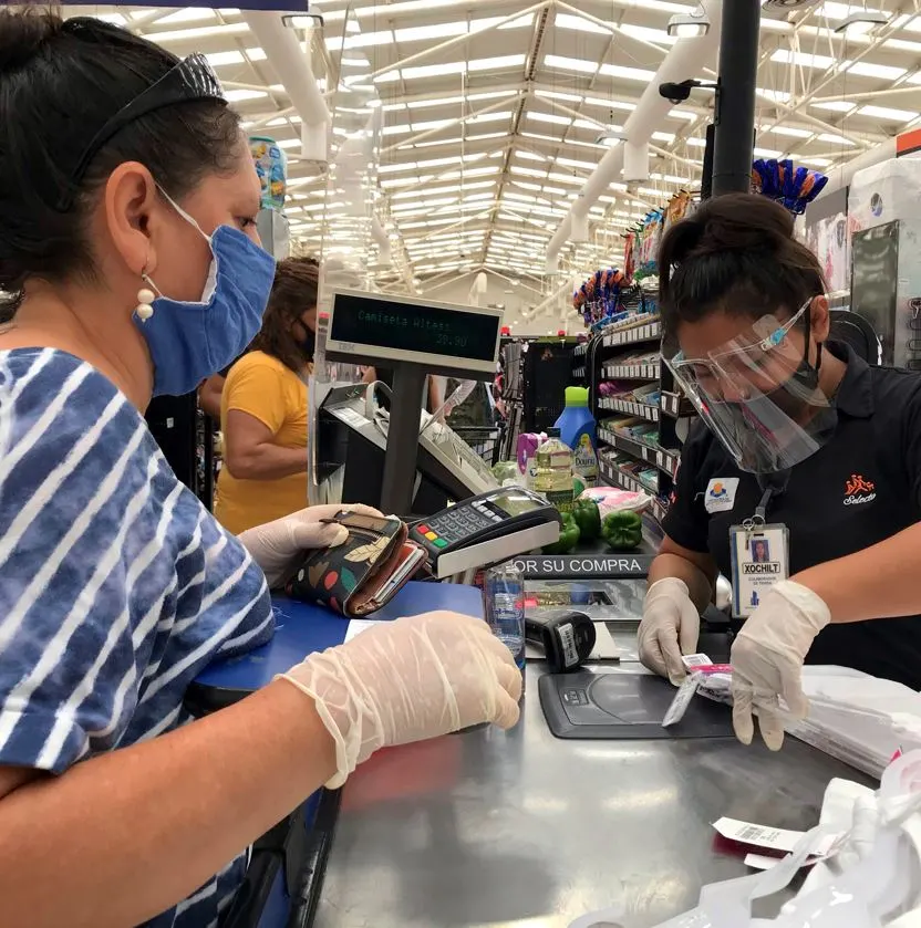 Women wearing masks at grocery store