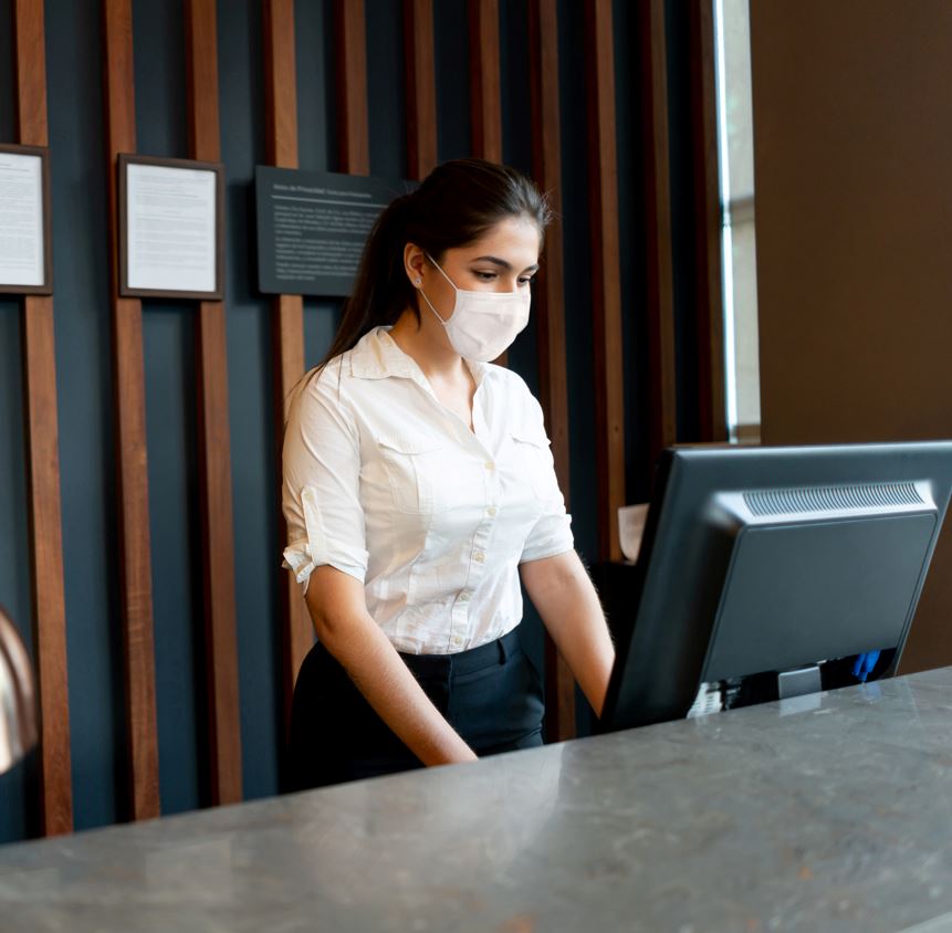 woman working in reception of hotel
