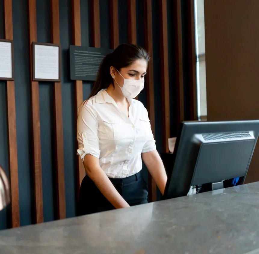 woman working in reception of hotel