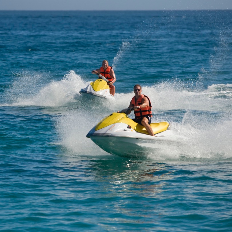 Tourist jet skiing in the water in Los Cabos, Mexico.