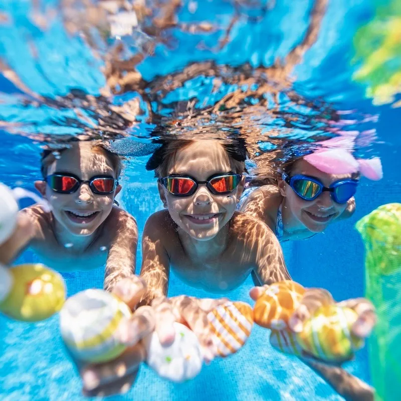 Kids playing underwater during summer Easter