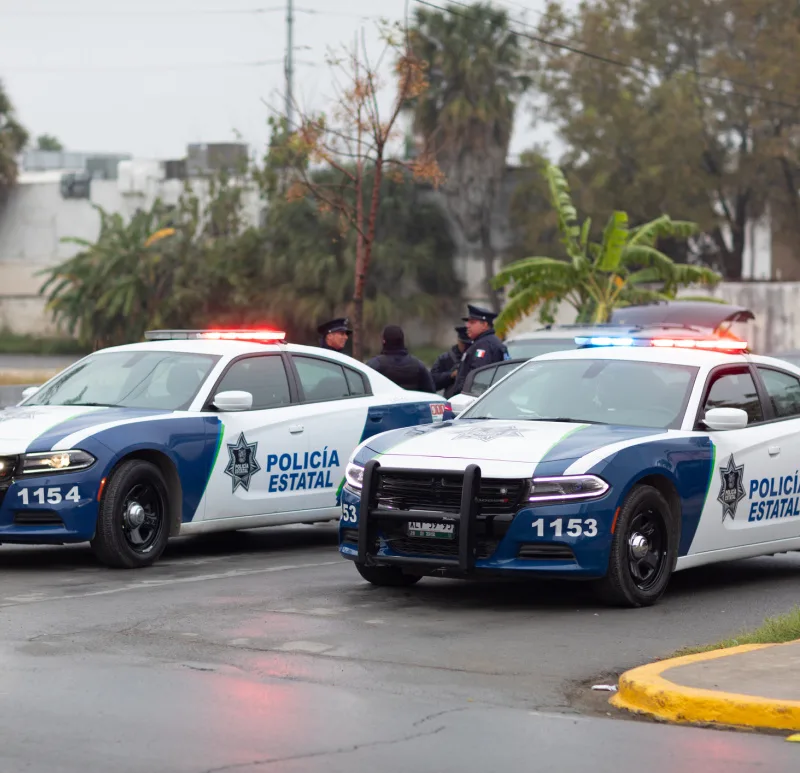 State police outdoors with lights on vehicles.