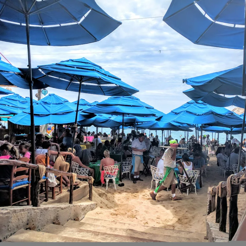 tourists eating at beach restaurant