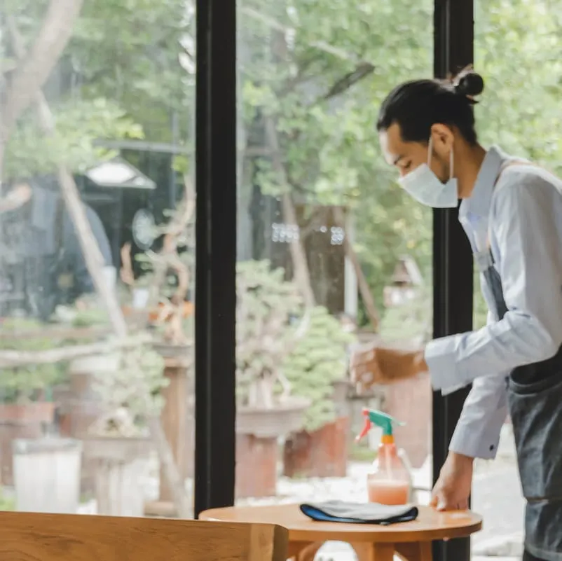 hotel worker cleaning