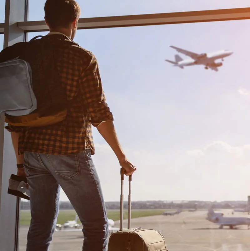 man waiting for plane