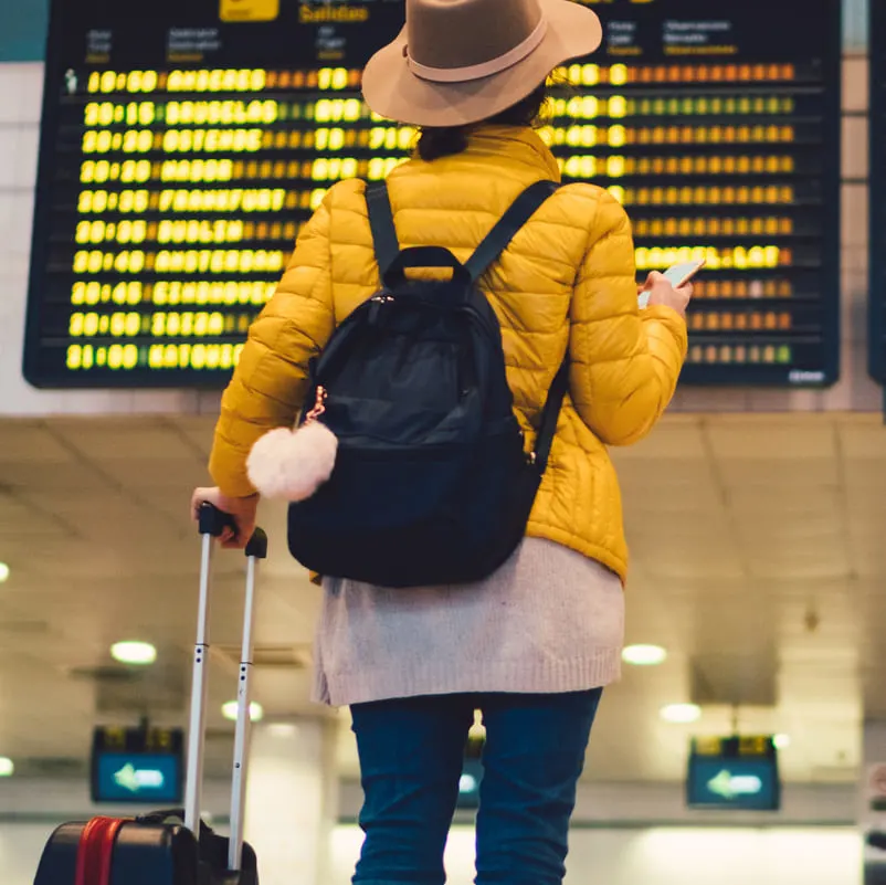 Woman looking at boarding schedule