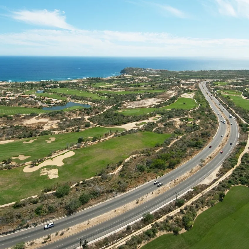 Los Cabos Tourist Corridor Surrounded by Green Grass and the Sea