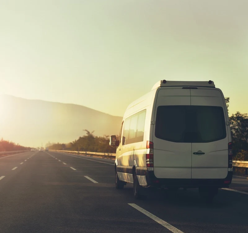 shuttle van going through a road