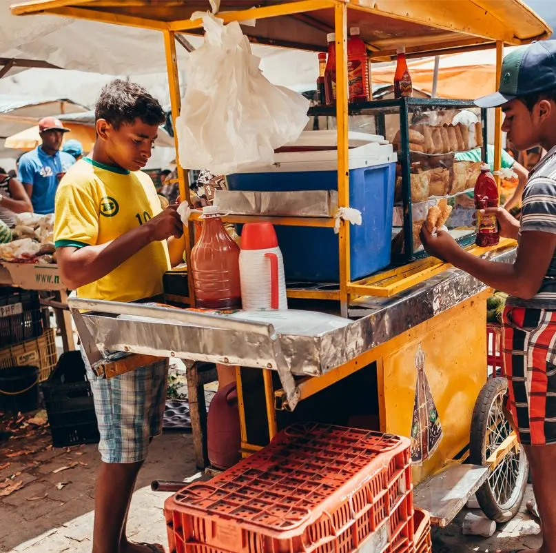 Teens Selling Food Near Beach