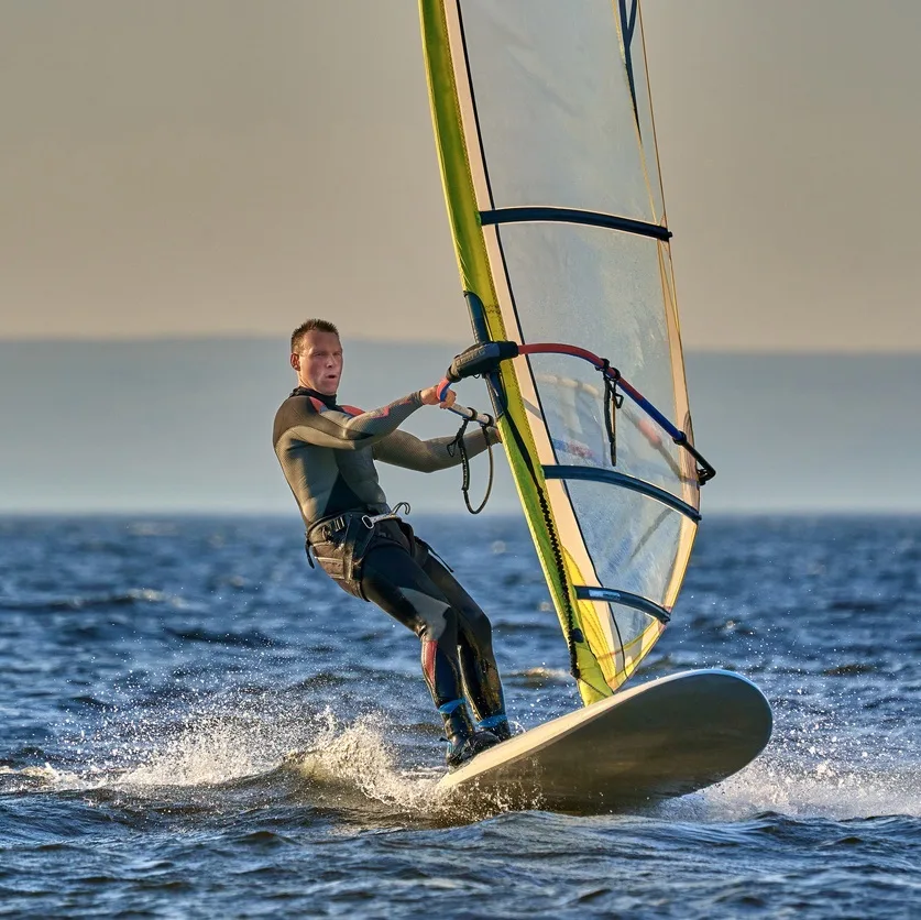 Man windsurfing in the sea