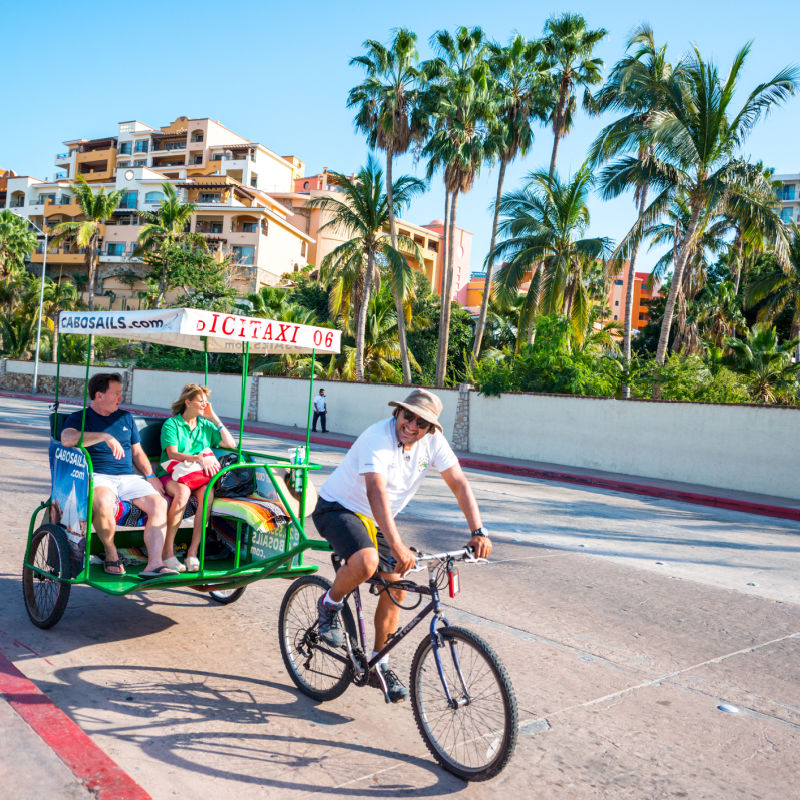 tourists on bicycle taxi