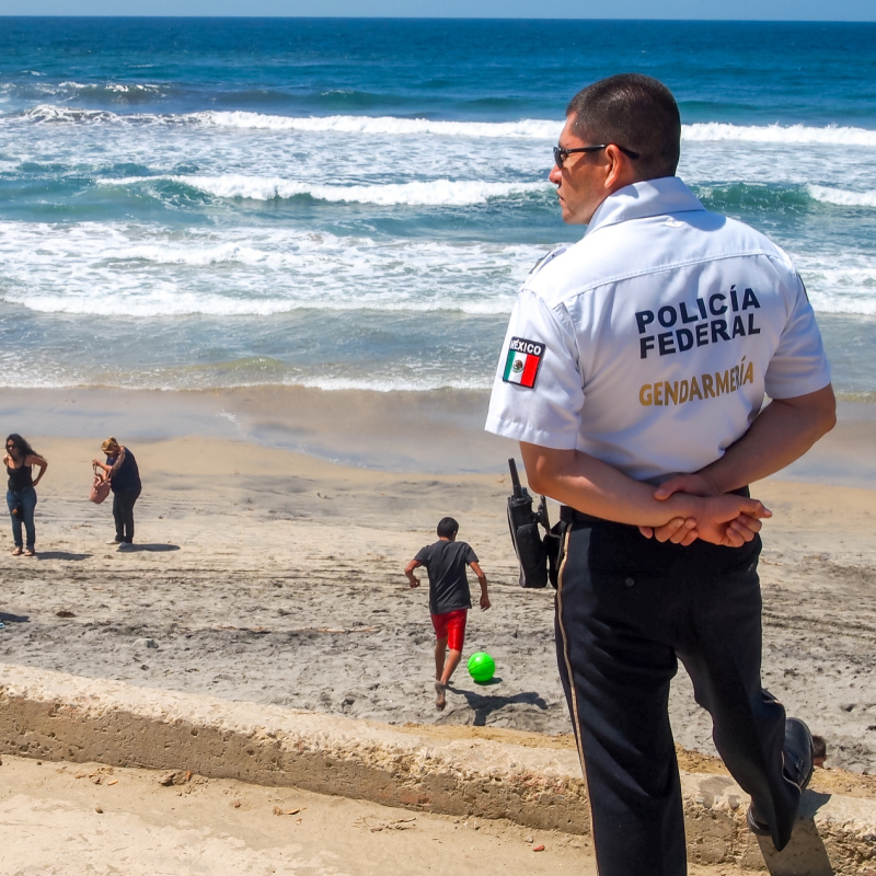 Federal police officer monitoring beach