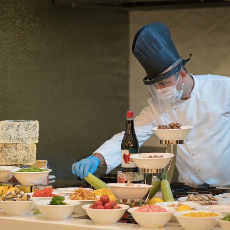 chef wearing protective mask