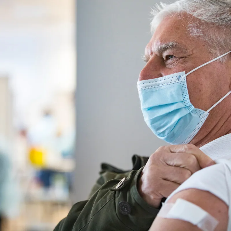 senior getting covid vaccine