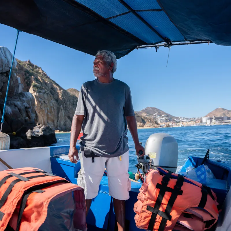 tourist boat captain with lifejackets