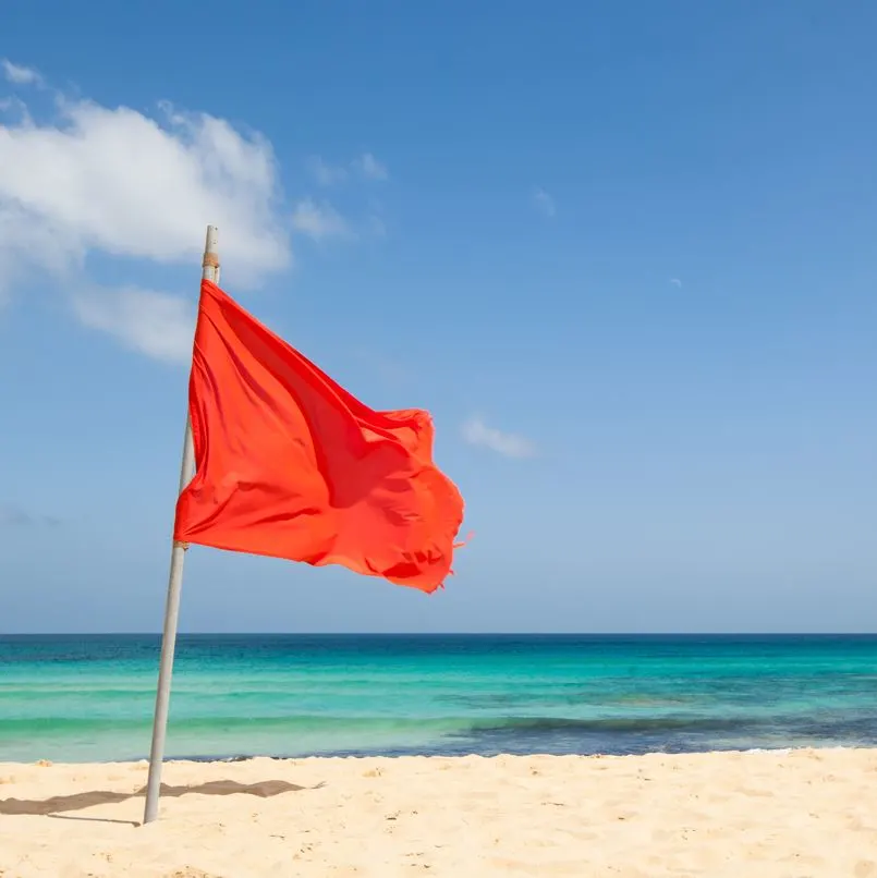 Red flag posted on the beach