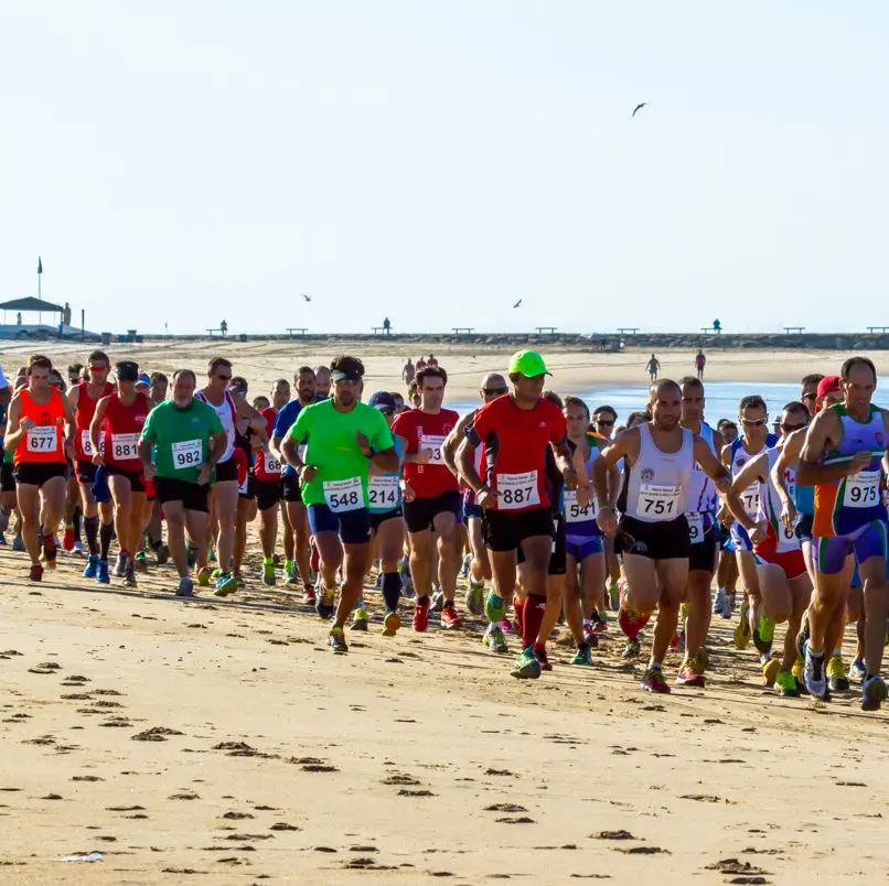 Runners on a beach in los cabos