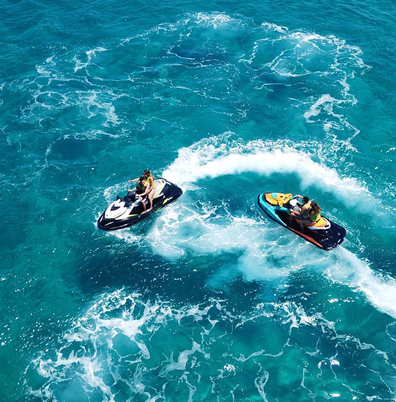 people on a jet ski in cabo
