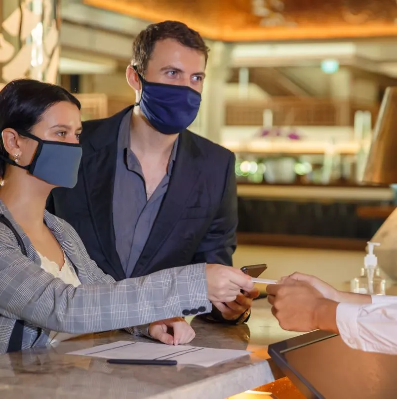 Couple checking into hotel