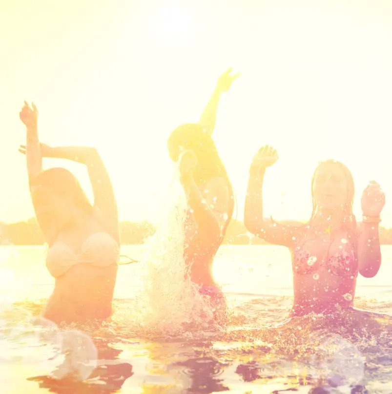 Girls splashing in the beach