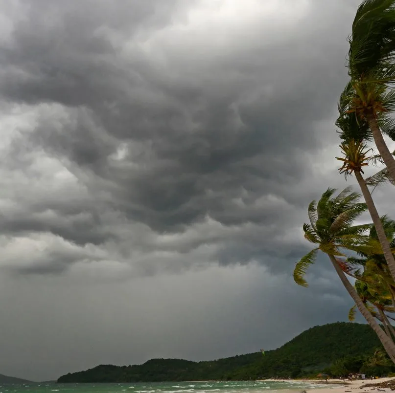 Dark clouds bringing a storm to a beach