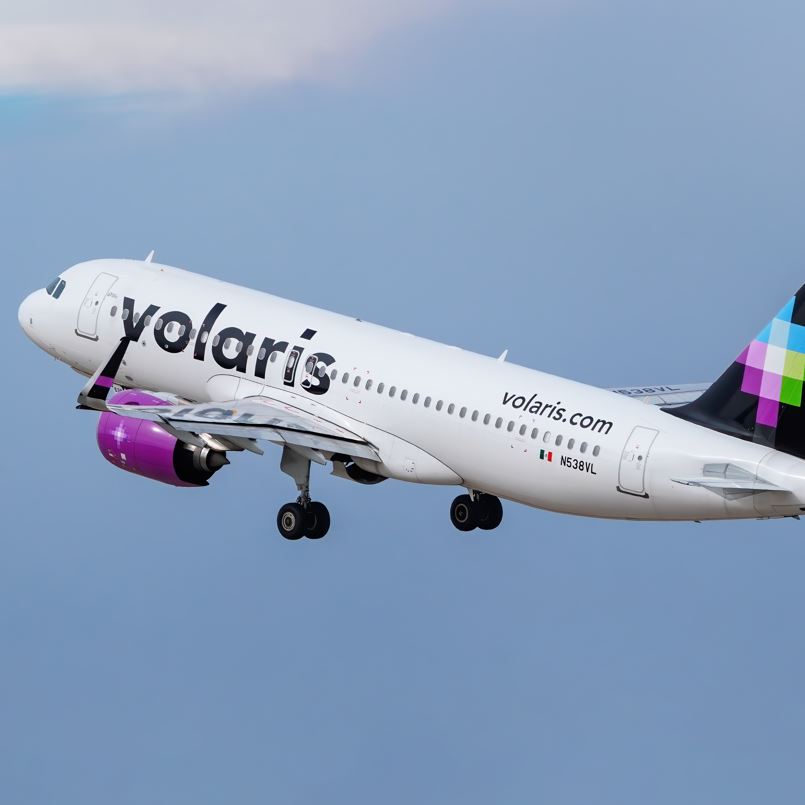 Volaris plane climbing up into the sky on a flight