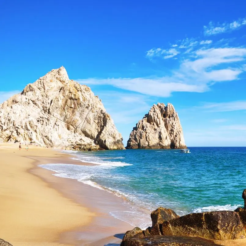 Beautiful Los Cabos Beach with a Boat in the Background.