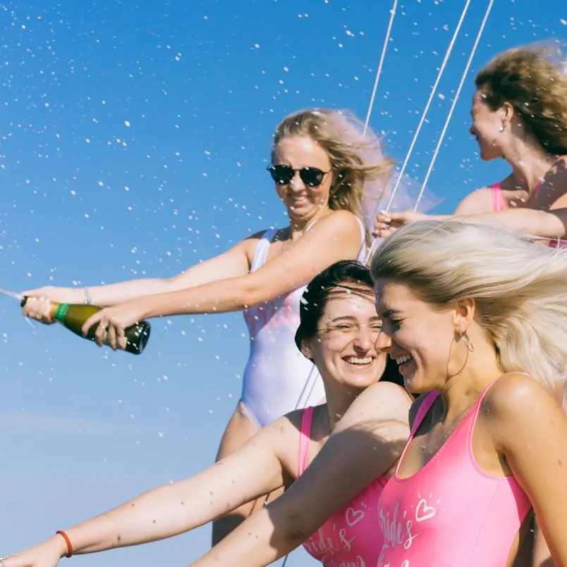 Girls with champagne on boat