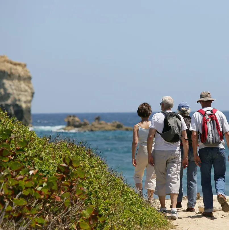 People hiking near beach los cabos