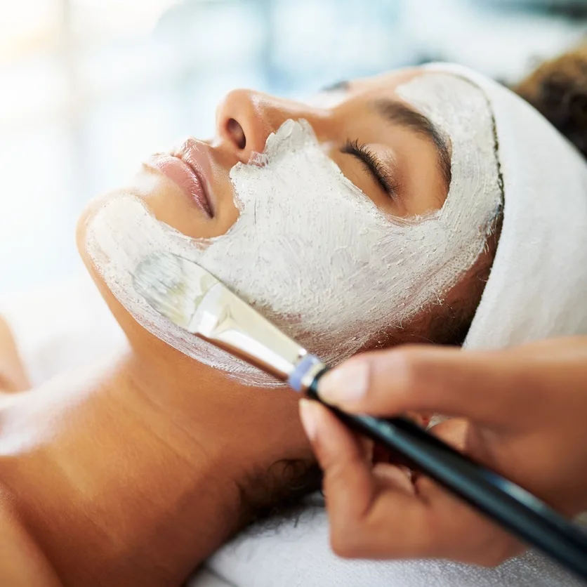 Woman getting a facial spa treatment