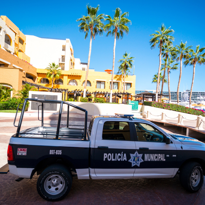 police vehicle near boardwalk