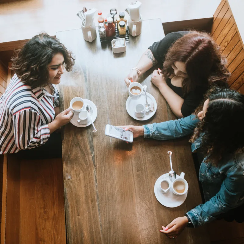 three women at dining table