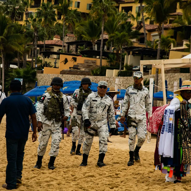 national guard officers patrolling a beach