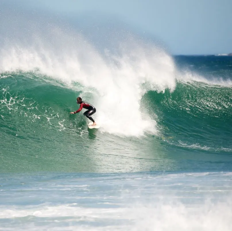 1Surfer-catching-a-large-wave-in-the-ocean