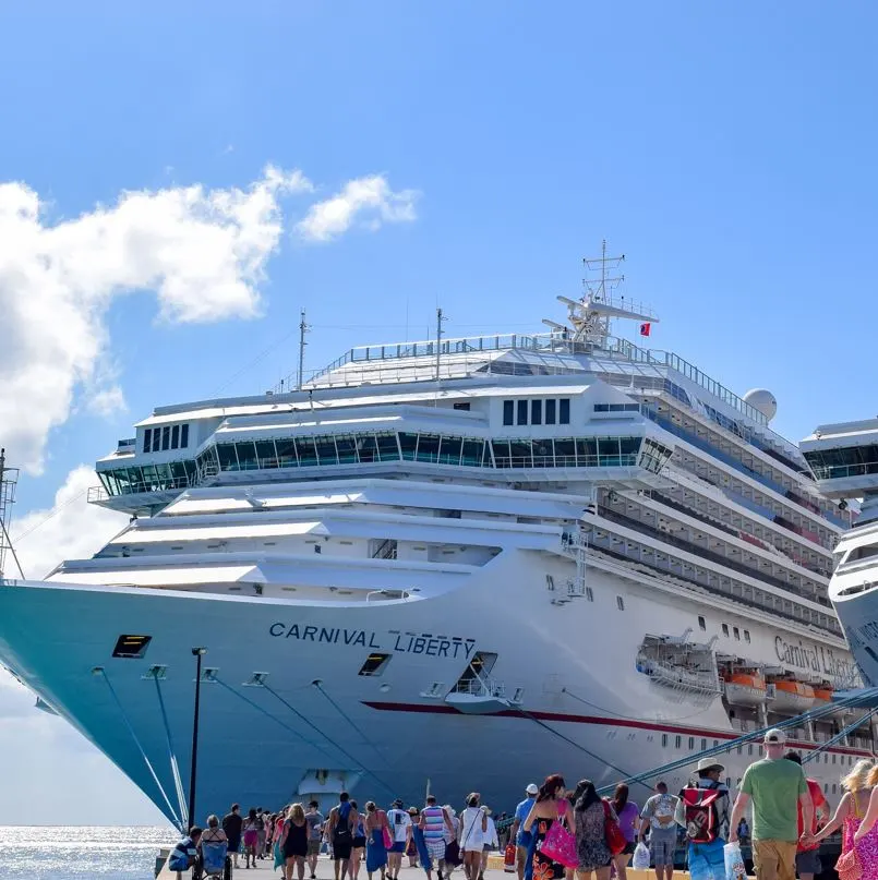 Crowd of passengers returning to board Carnival Liberty cruise ship