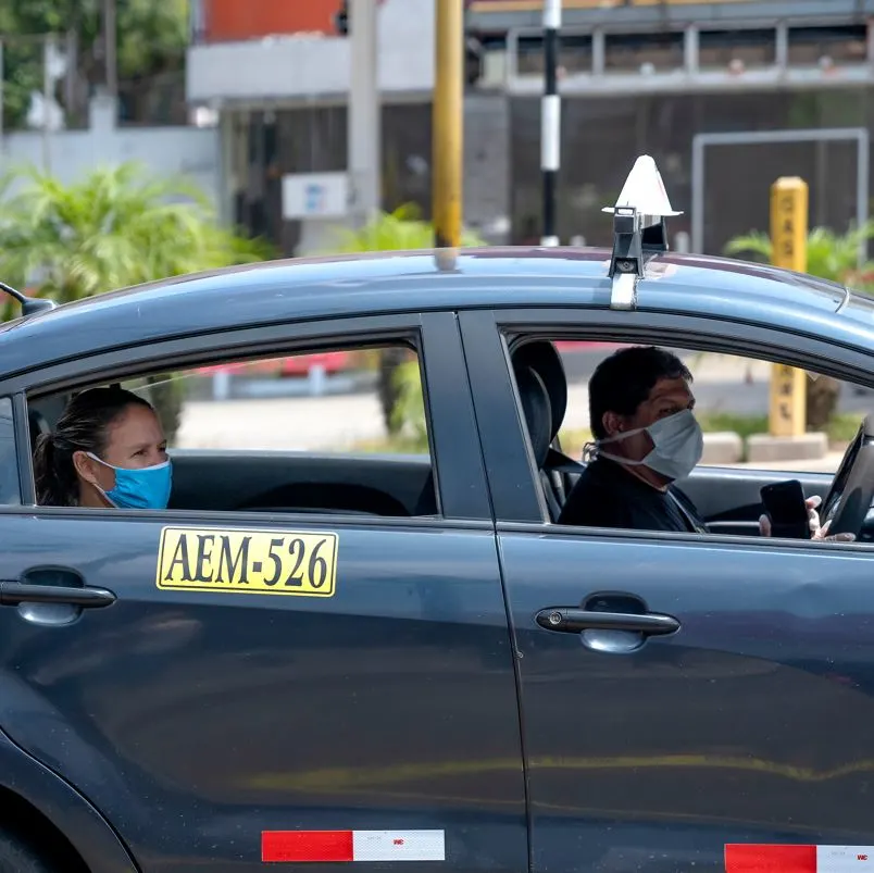 Taxi with guest in the back