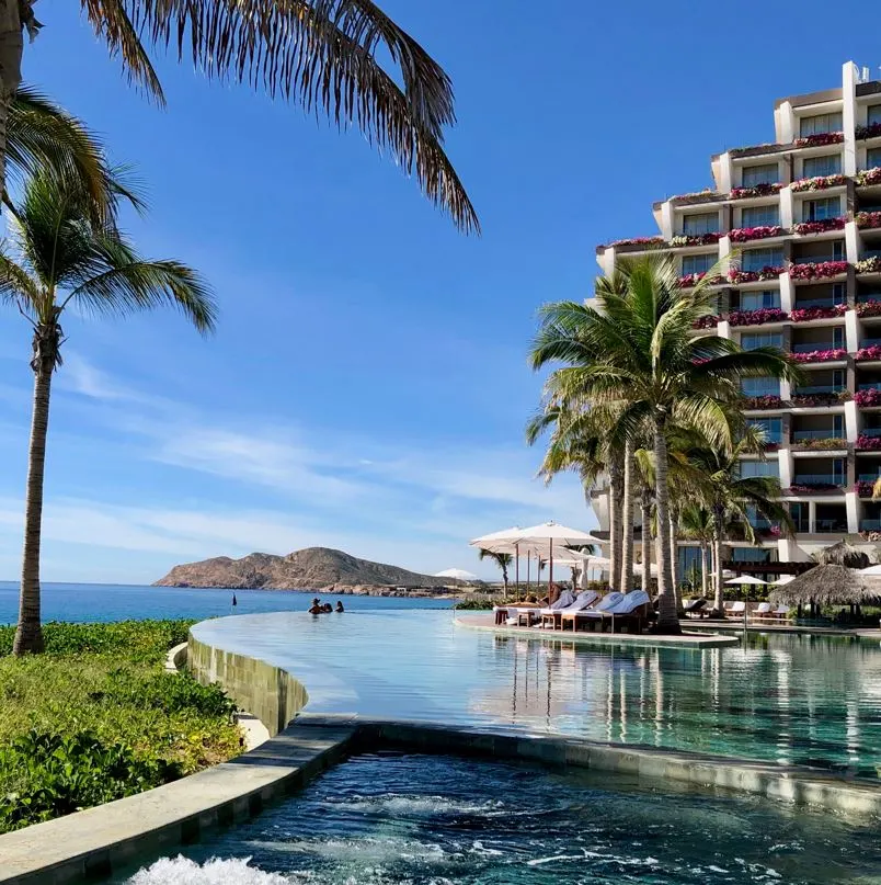 Los Cabos resort with pool and flowers in balcony