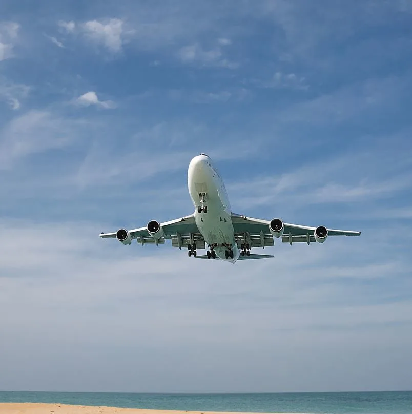 Plane flying over the ocean