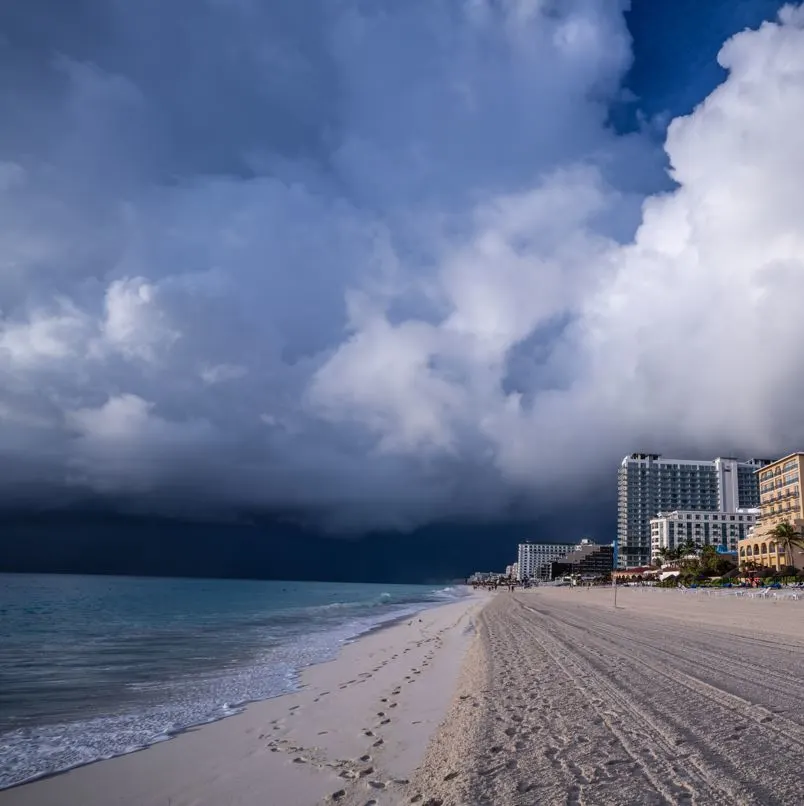 Black hurricane clouds form over the beach in Los Cabos