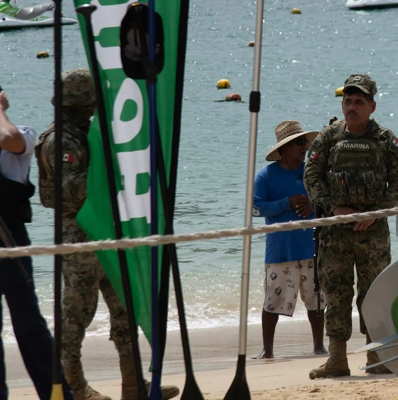 Mexican police on beach with kiosk