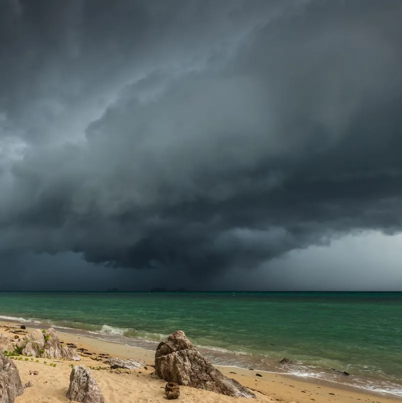 Storm with dark clouds near beach