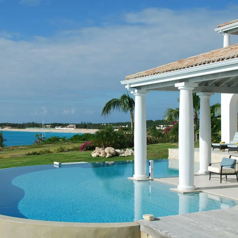 large luxury villa that overlooks the beach