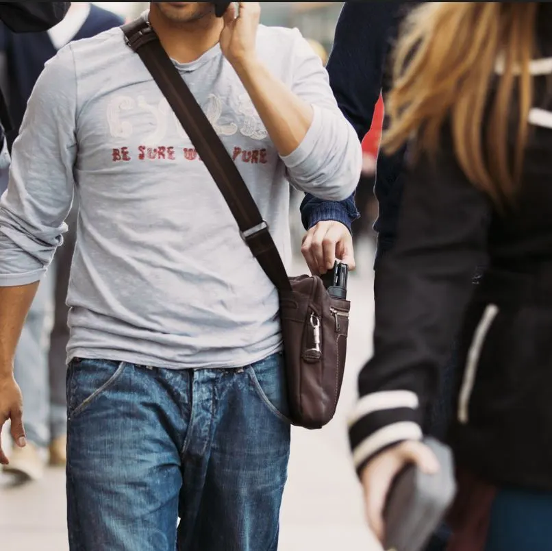 pickpocketting from an open bag on the street