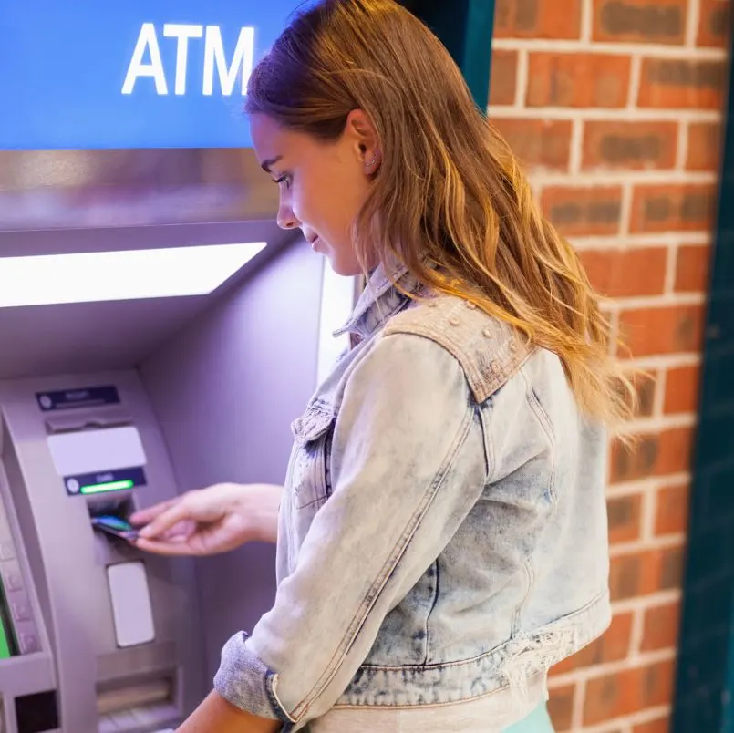 Girl using ATM