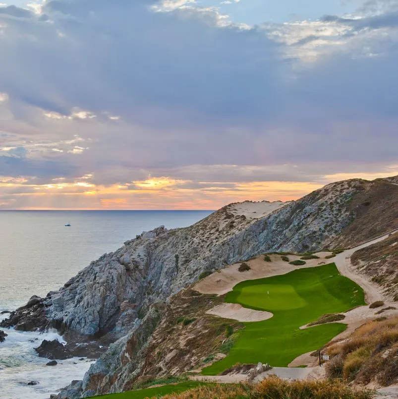 Golf course near the ocean at sunset