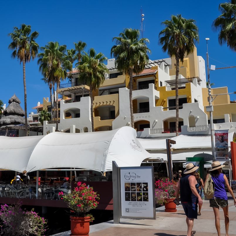 Tourists walking in Los Cabos marina