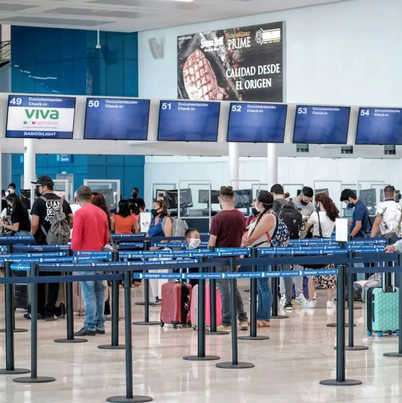 People Waiting in Line at Airport
