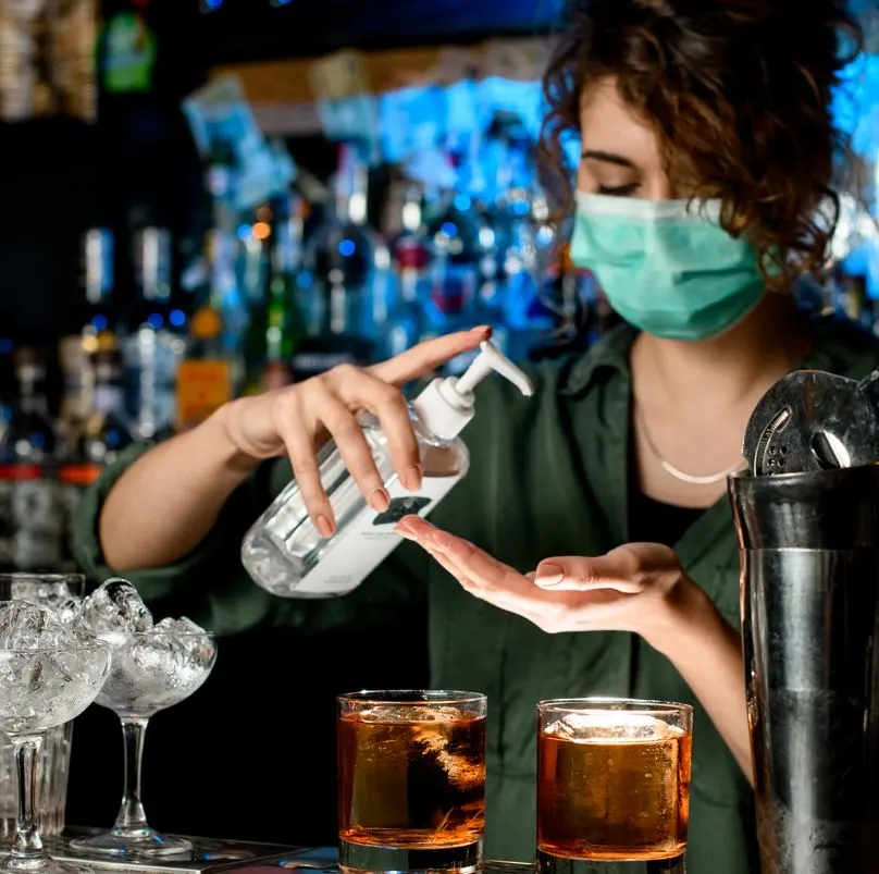 Bar Tender Using Hand Sanatizer