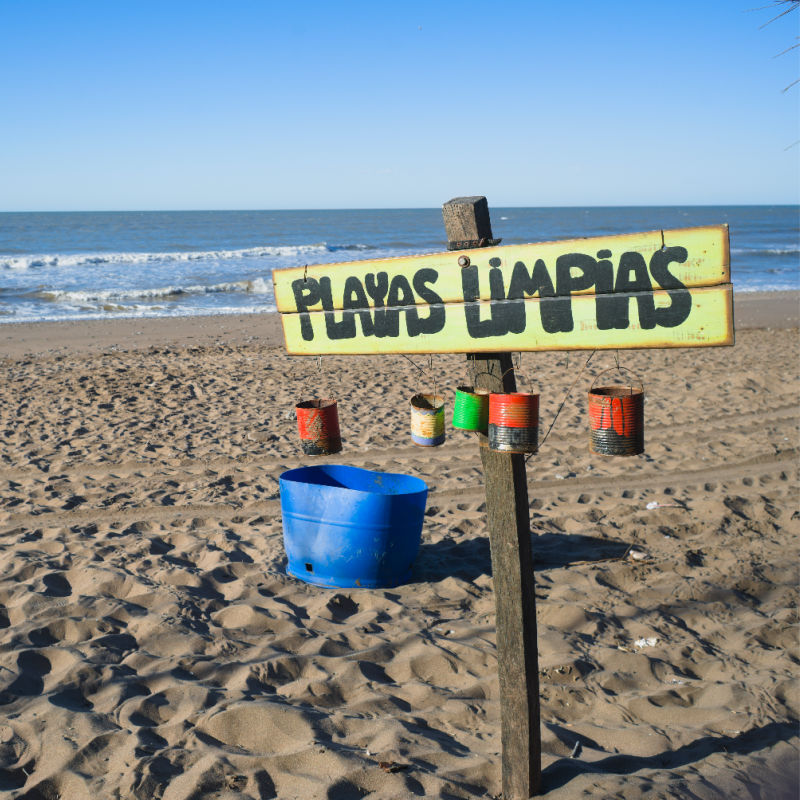 Clean beach sign on beach in Mexico